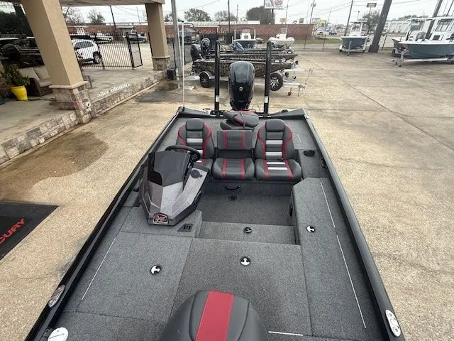 Slide: The Image of 2023 Ranger RT178 boat with gray and red seats on a parking lot. - 27