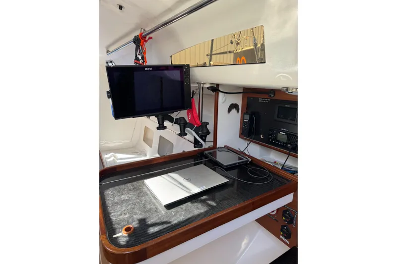Slide: The Image of 2019 J Boats J/121 navigation station with electronics and laptop setup. - 15