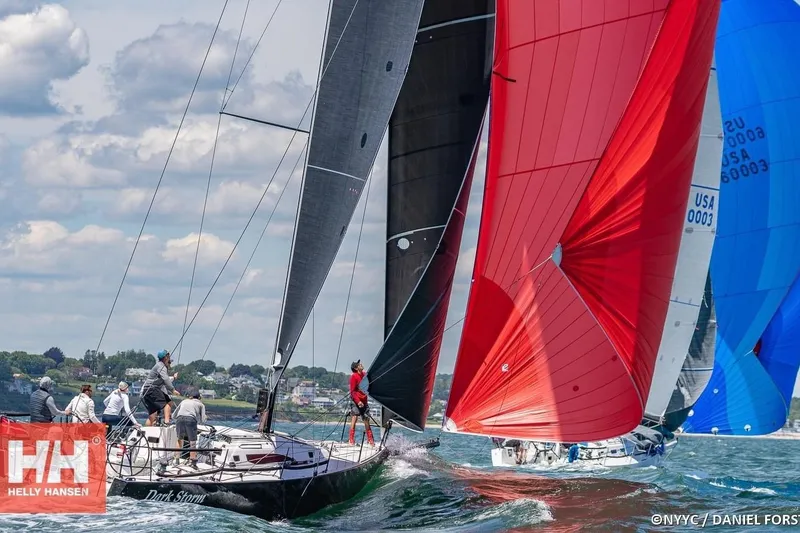 Slide: The Image of Sailboats racing with colorful spinnakers, featuring a 2019 J Boats J/121 model. - 4