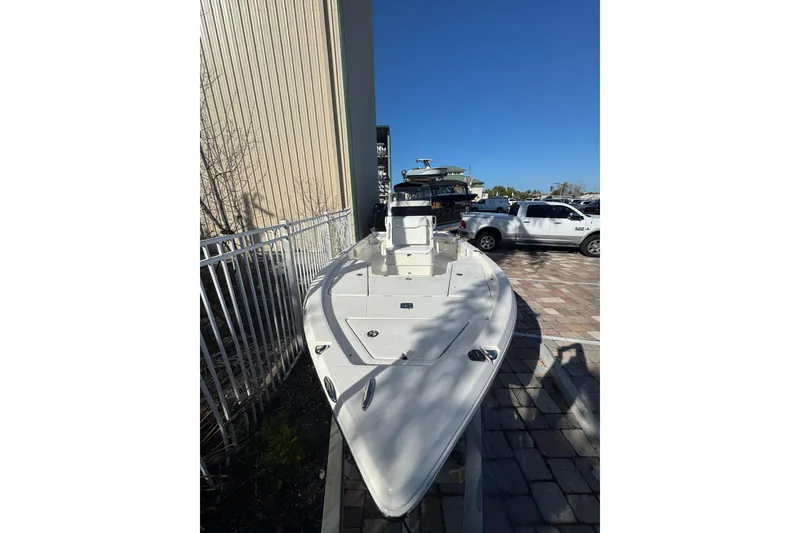 Slide: The Image of 2026 Skeeter SX221 boat displayed outdoors on a sunny day. - 10