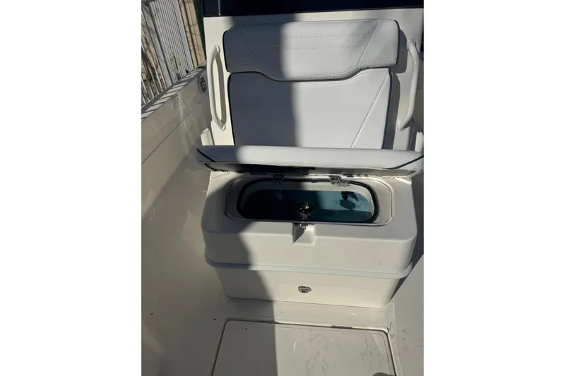 Slide: The Image of 2026 Skeeter SX221 boat seat with built-in storage compartment. - 18