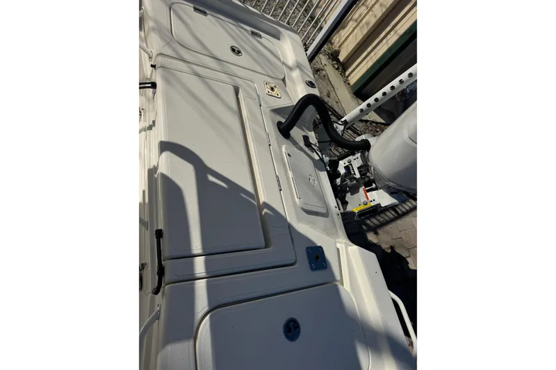 Slide: The Image of 2026 Skeeter SX221 boat deck with storage compartments and equipment. - 23