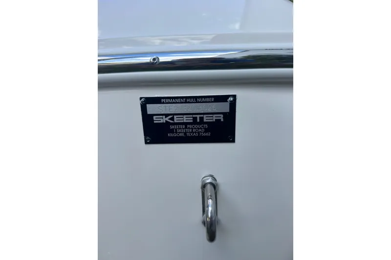 Slide: The Image of 2026 Skeeter SX221 boat hull identification plate with company details. - 27