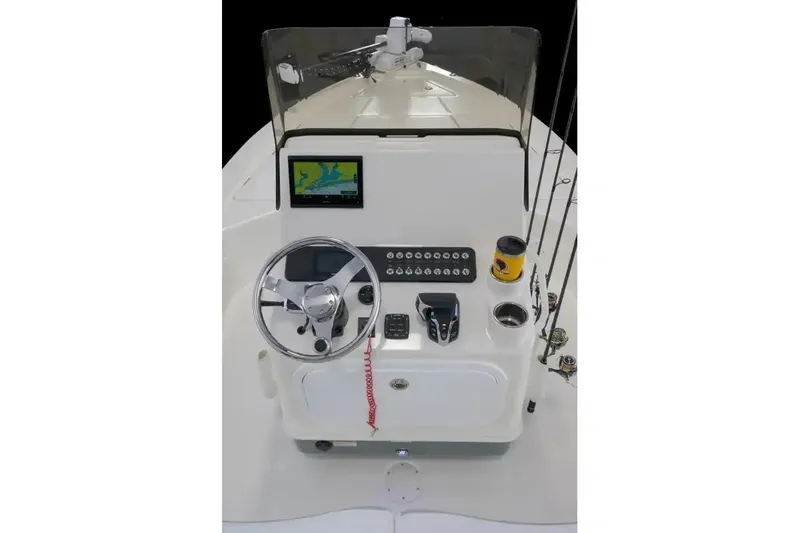 Slide: The Image of Manufacturer Provided Image: 2026 Skeeter SX221 boat console with steering wheel, navigation screen, and controls. - 4