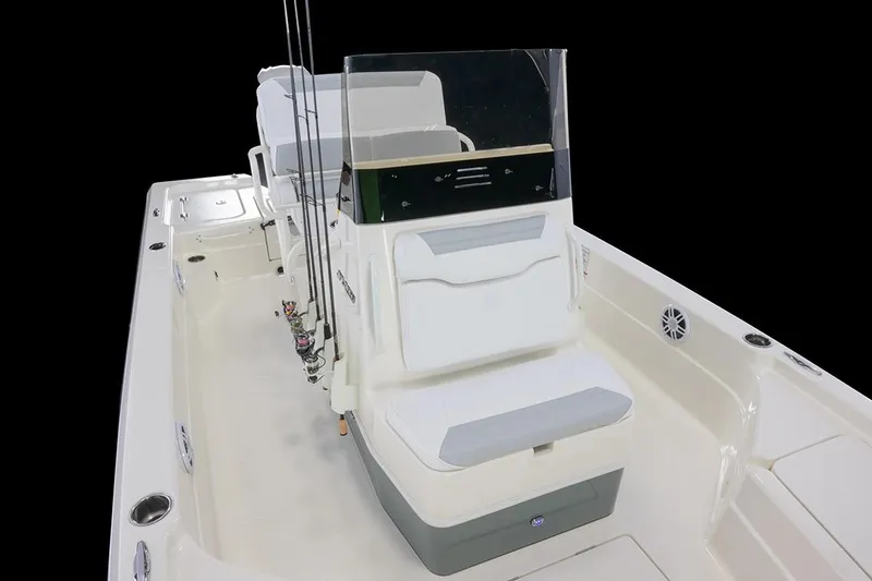 Slide: The Image of Manufacturer Provided Image: 2026 Skeeter SX221 boat interior with seating and fishing rod holders. - 6