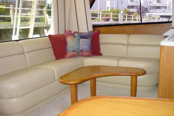 Slide: The Image of Control panel of a 1996 Viking 50 Convertible yacht with navigation screens and steering wheel. - 10