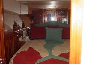 Slide: The Image of Cummins Onan marine generator in a 1996 Viking 50 Convertible yacht engine room. - 15