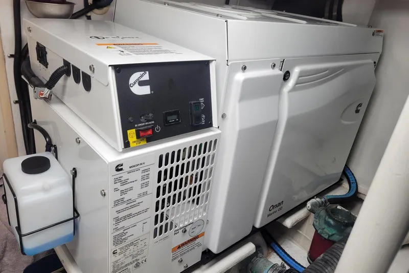 Slide: The Image of 1996 Viking 50 Convertible boat deck with teak flooring and covered seating. - 21