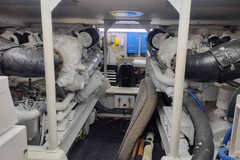 Slide: The Image of Interior cabin of a 1996 Viking 50 Convertible yacht with a cozy bed setup. - 22