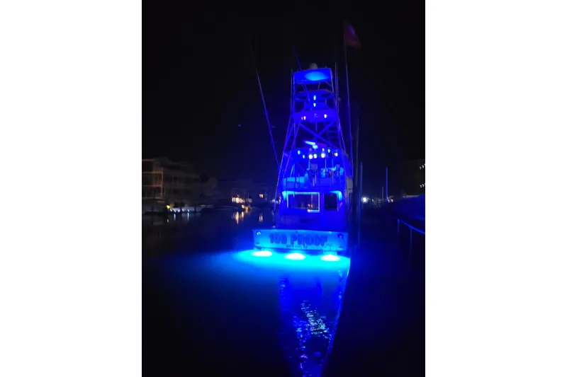 Slide: The Image of Interior of a 1996 Viking 50 Convertible yacht with elegant wood finishes and seating. - 24