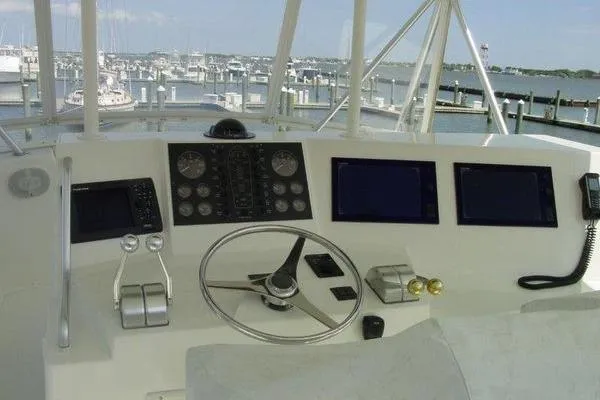 Slide: The Image of 1996 Viking 50 Convertible yacht docked at marina, covered and ready for use. - 4