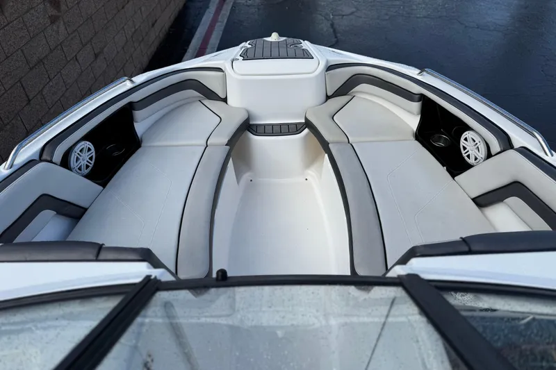 Slide: The Image of 2018 Yamaha Boats AR240 interior with spacious seating and modern design. - 11