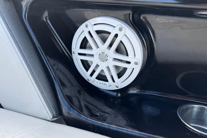Slide: The Image of White JL Audio speaker on 2018 Yamaha AR240 boat interior. - 14
