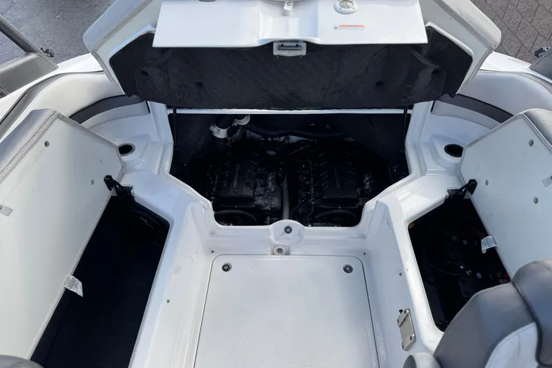 Slide: The Image of 2018 Yamaha Boats AR240 engine compartment with open hatches, showcasing dual engines. - 18