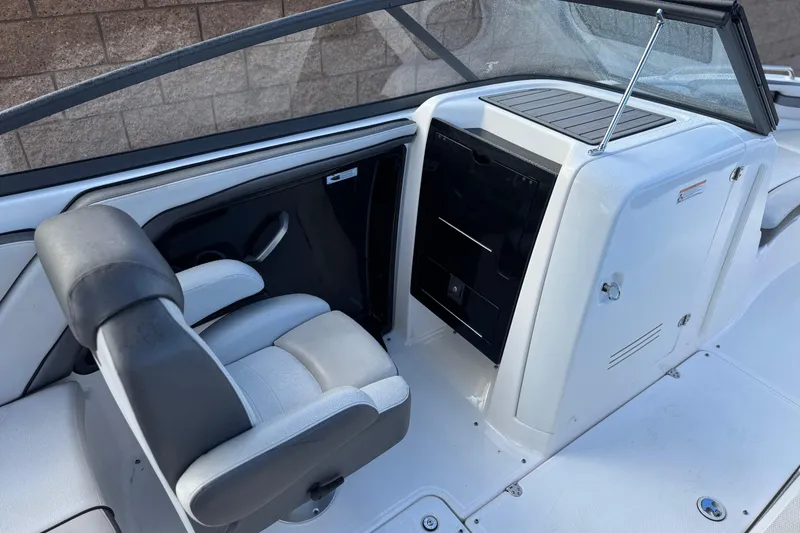 Slide: The Image of 2018 Yamaha Boats AR240 interior with seating and console, showcasing modern design. - 20