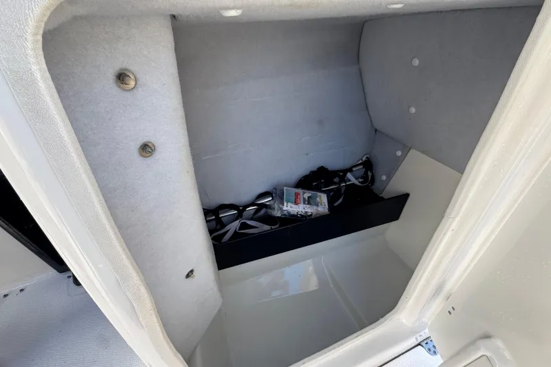 Slide: The Image of Storage compartment in 2018 Yamaha AR240 boat, featuring interior details and accessories. - 22