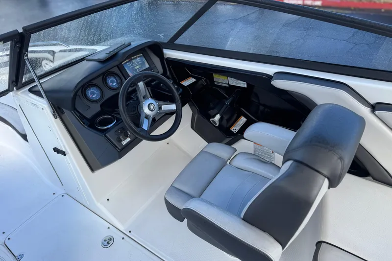 Slide: The Image of 2018 Yamaha Boats AR240 cockpit with steering wheel and dashboard controls. - 24