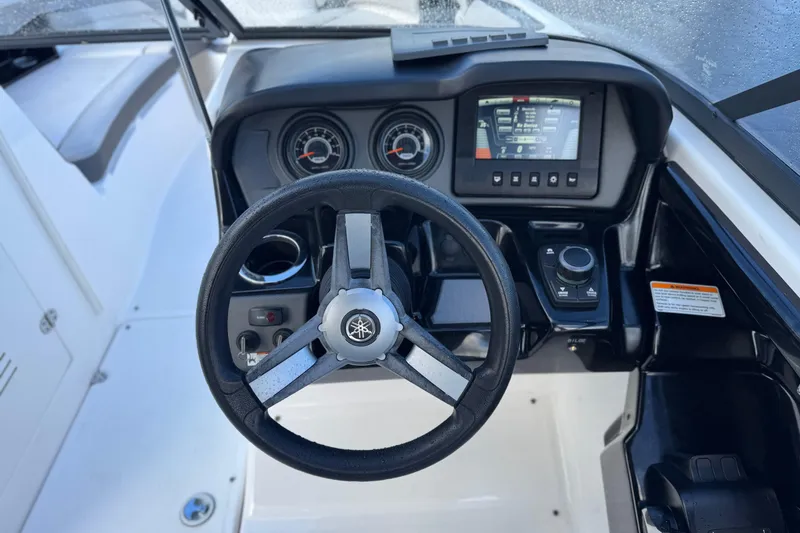 Slide: The Image of 2018 Yamaha Boats AR240 dashboard with steering wheel and control panel. - 25