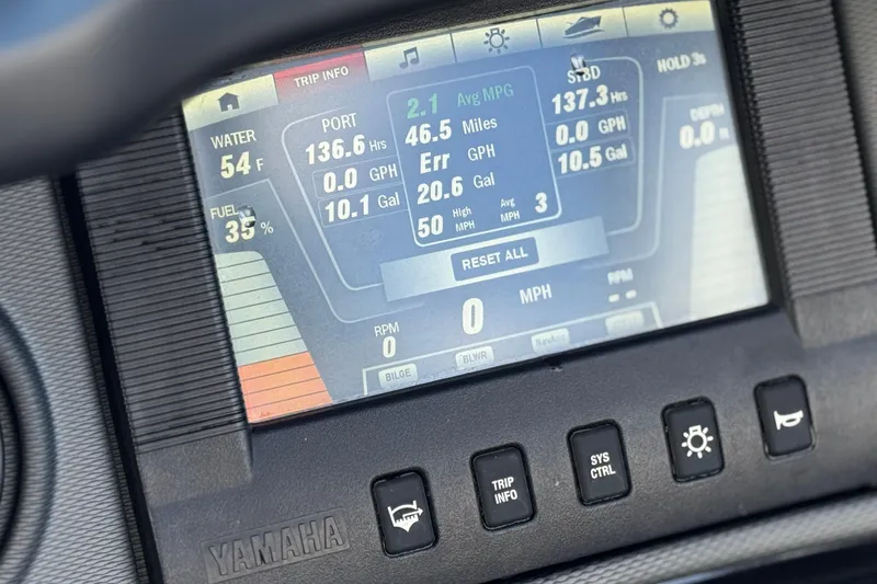 Slide: The Image of Dashboard display of a 2018 Yamaha Boats AR240 showing trip information and fuel levels. - 26