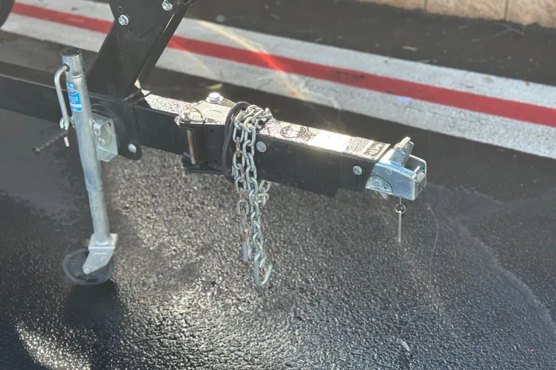 Slide: The Image of Trailer hitch of a 2018 Yamaha Boats AR240 on wet pavement. - 30