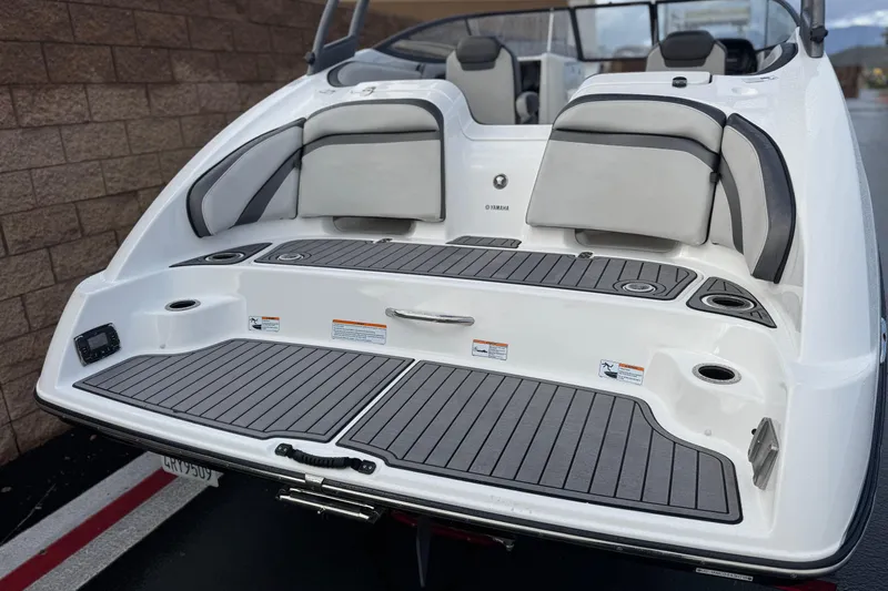 Slide: The Image of 2018 Yamaha Boats AR240 swim platform with cushioned seating and sleek design. - 6