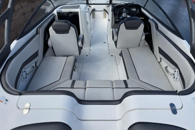 Slide: The Image of 2018 Yamaha Boats AR240 interior with spacious seating and modern design. - 9