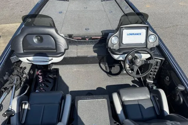 Slide: The Image of 2022 Phoenix 721 ProXP boat interior with Lowrance electronics and dual seating. - 11