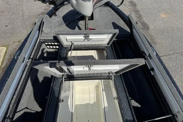 Slide: The Image of 2022 Phoenix 721 ProXP boat interior with open storage compartments. - 14