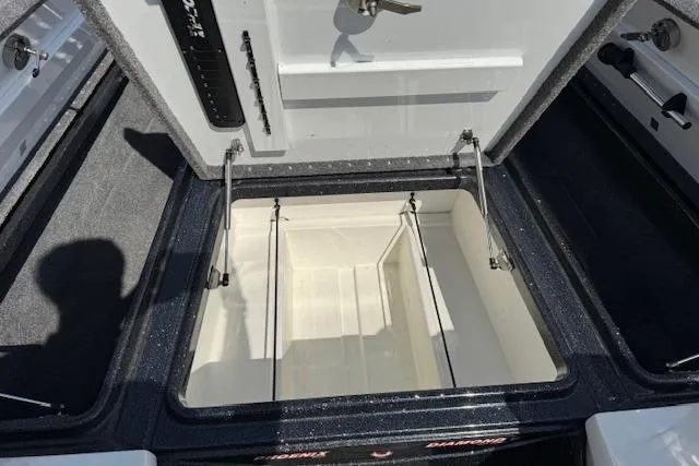 Slide: The Image of Open storage compartment of 2022 Phoenix 721 ProXP boat, showcasing interior space. - 15
