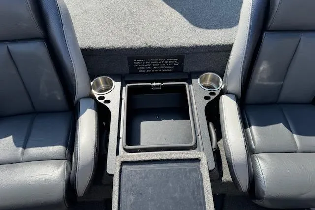 Slide: The Image of 2022 Phoenix 721 ProXP boat interior with dual seats and center storage. - 19
