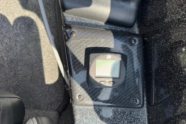 Slide: The Image of Control panel in a 2022 Phoenix 721 ProXP boat, featuring a digital display. - 20