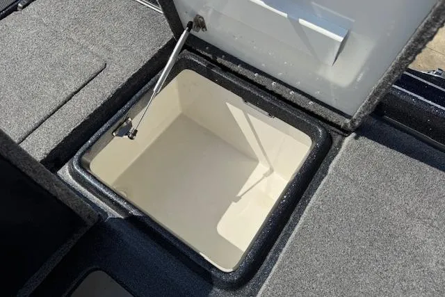 Slide: The Image of 2022 Phoenix 721 ProXP boat storage compartment with open lid, showcasing spacious interior. - 23