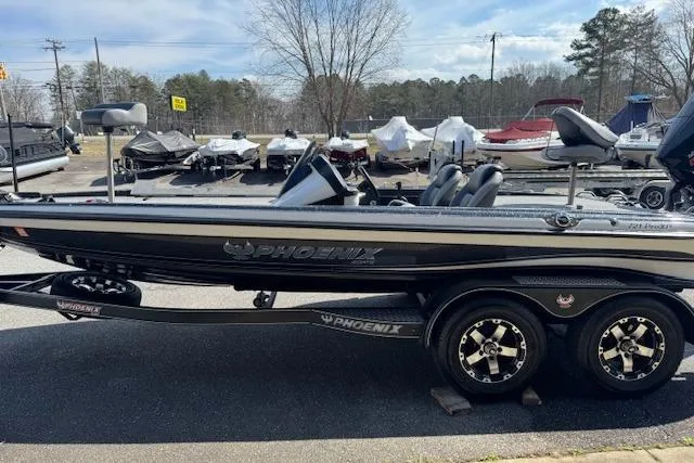 Slide: The Image of 2022 Phoenix 721 ProXP bass boat on trailer in outdoor dealership lot. - 3