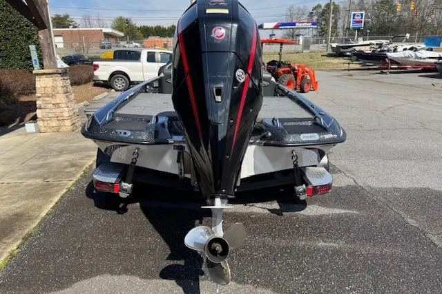 Slide: The Image of 2022 Phoenix 721 ProXP boat with powerful outboard motor, parked in a lot. - 5
