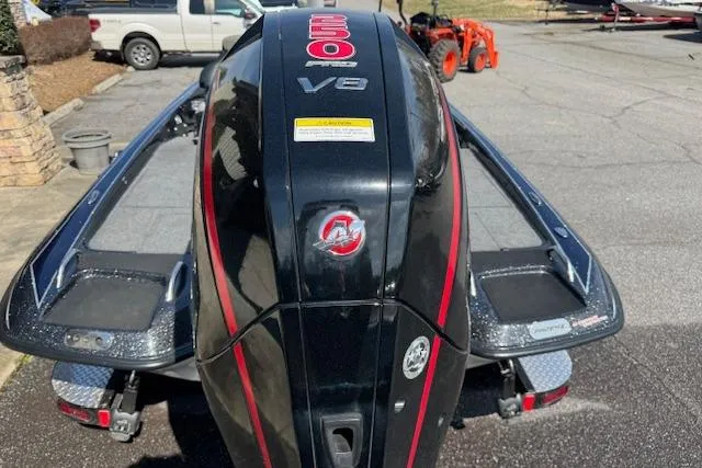 Slide: The Image of 2022 Phoenix 721 ProXP boat with powerful V8 engine, parked outdoors. - 6