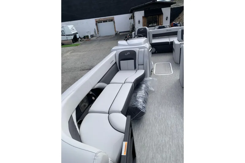 Slide: The Image of 2022 Barletta Corsa 25U pontoon boat interior with luxurious seating and modern design. - 4
