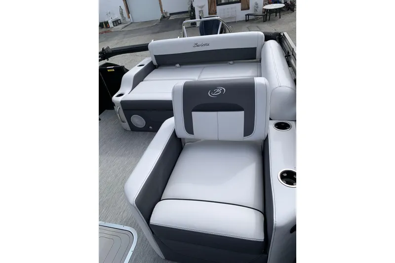Slide: The Image of 2022 Barletta Corsa 25U boat interior with luxurious seating and cup holders. - 8