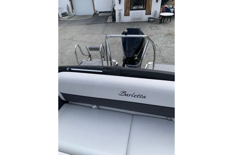 Slide: The Image of 2022 Barletta Corsa 25U boat with sleek seating and modern design. - 9