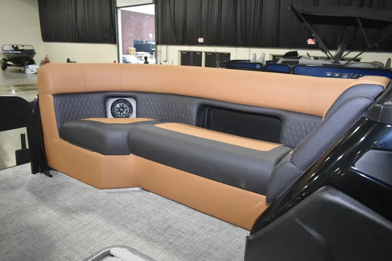 Slide: The Image of Luxurious seating on 2026 Premier 230 Sunsation Angler 2pt boat, featuring tan and gray upholstery. - 11