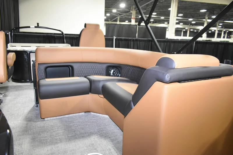Slide: The Image of Luxurious interior of 2026 Premier 230 Sunsation Angler 2pt boat with tan and black seating. - 12