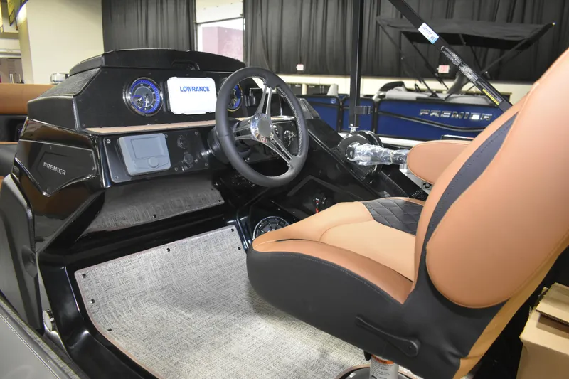 Slide: The Image of Interior of 2026 Premier 230 Sunsation Angler 2pt boat with steering wheel and dashboard. - 14