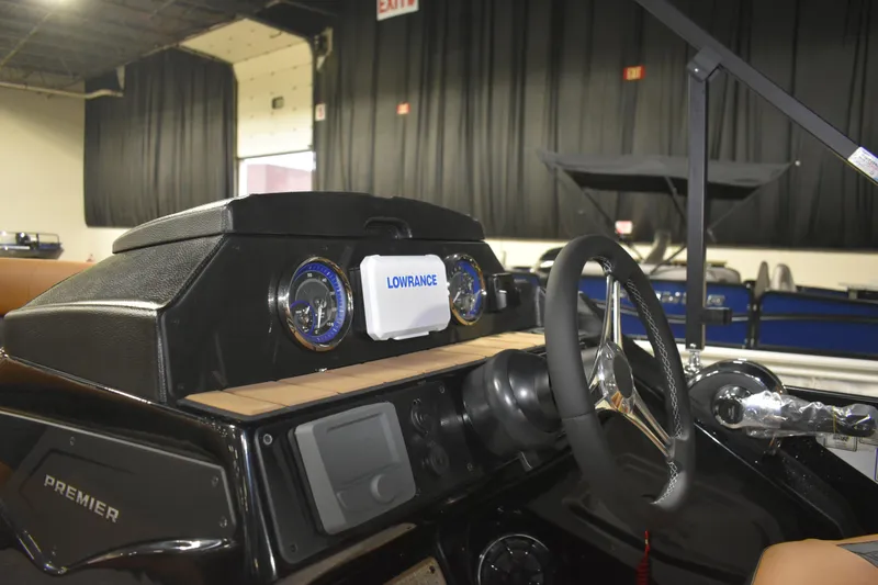 Slide: The Image of Interior view of 2026 Premier 230 Sunsation Angler 2pt boat dashboard with steering wheel. - 15