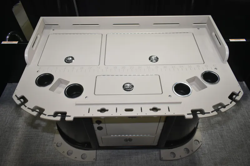 Slide: The Image of Premier 230 Sunsation Angler 2pt 2026 boat console with cup holders and storage compartments. - 19