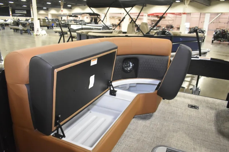 Slide: The Image of 2026 Premier 230 Sunsation Angler 2pt boat interior with storage compartment open. - 20