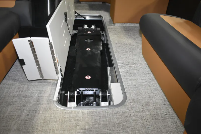 Slide: The Image of 2026 Premier 230 Sunsation Angler 2pt boat interior storage compartment open. - 23