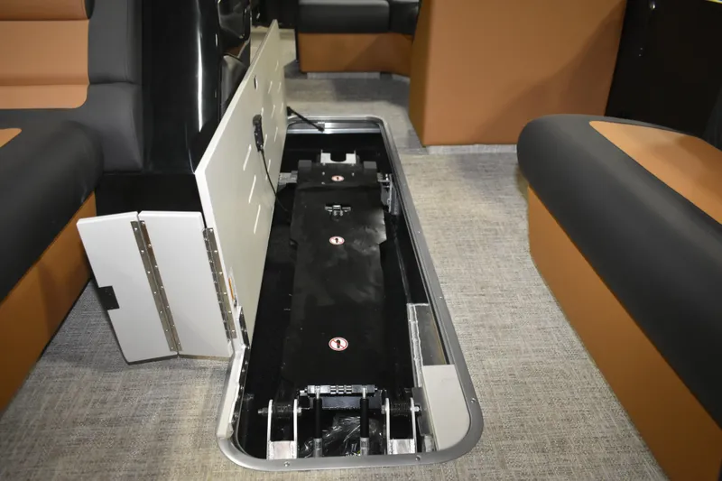 Slide: The Image of 2026 Premier 230 Sunsation Angler 2pt boat interior storage compartment open. - 24