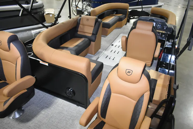 Slide: The Image of 2026 Premier 230 Sunsation Angler 2pt boat interior with tan and black seating. - 6