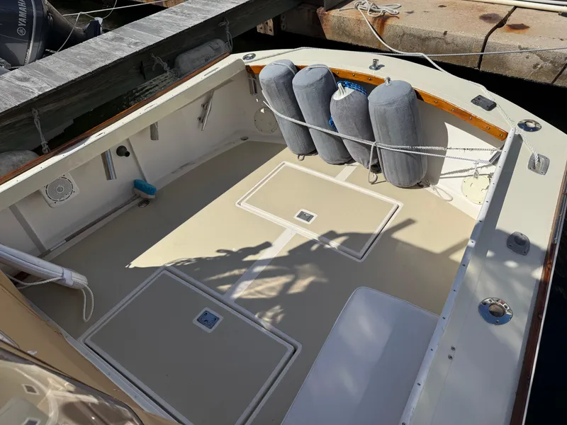 Slide: The Image of 1978 Dyer 29 Trunk Cabin boat deck with fenders and clean surface. - 23