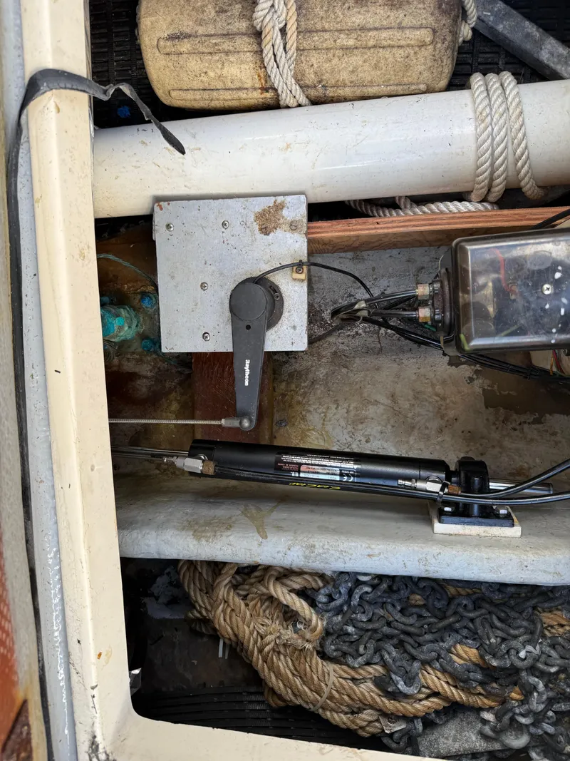 Slide: The Image of 1978 Dyer 29 Trunk Cabin interior with ropes, chains, and mechanical components. - 26