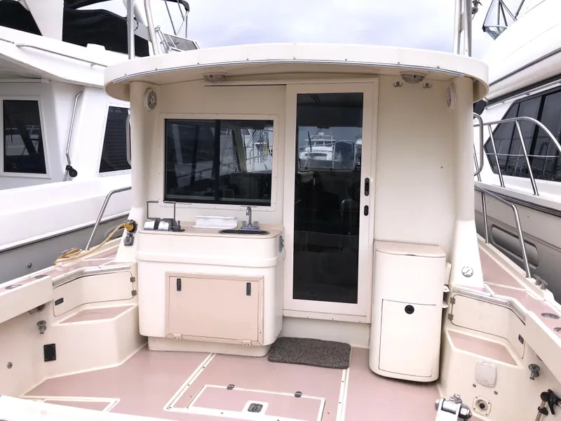 Slide: The Image of 2000 Albin 35 Tournament Express boat deck with cabin entrance and seating area. - 10